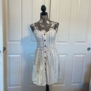 White Blue Stripped Button up dress with a stringed belt attached. Size small